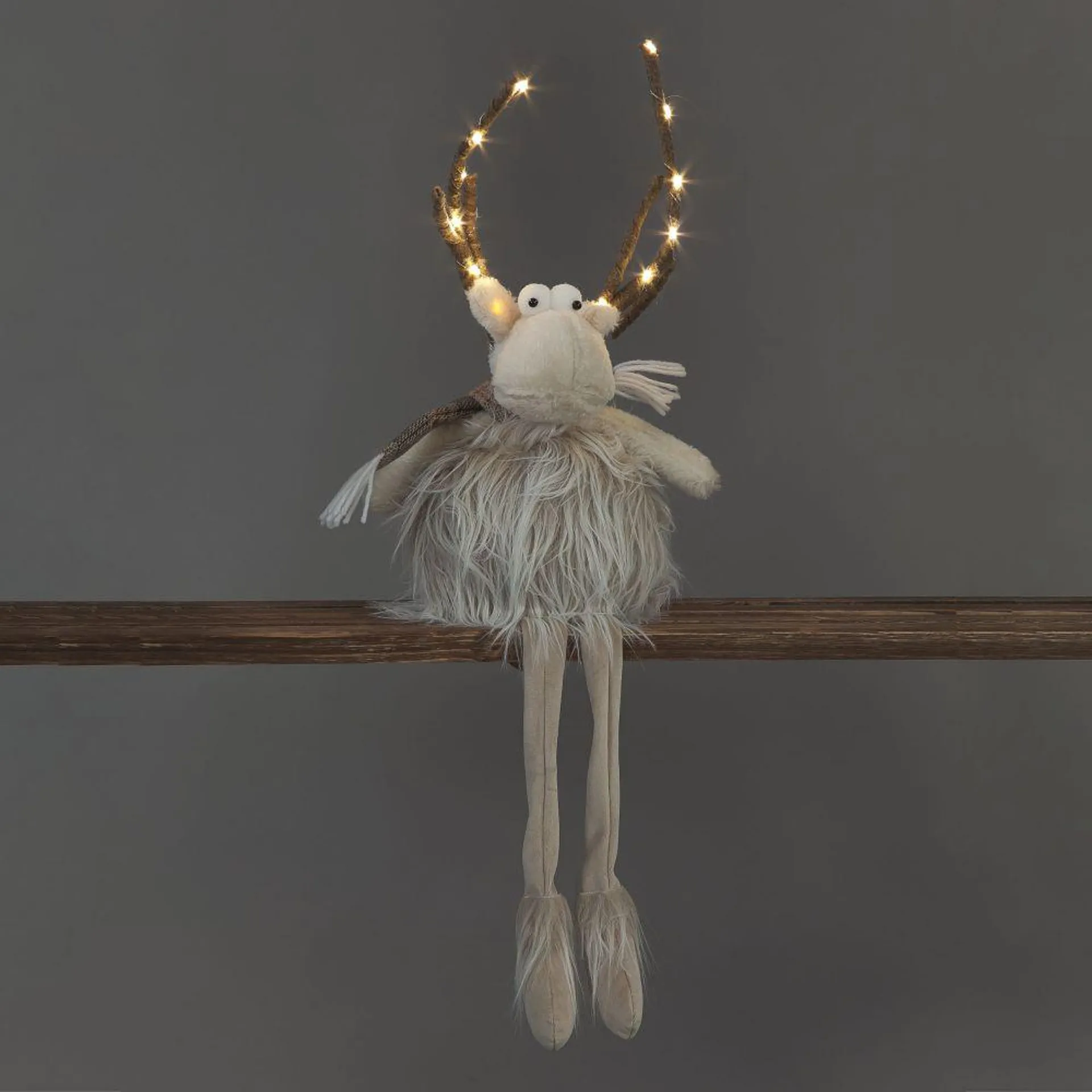 58cm sitting Reindeer Christmas decoration with light up antlers - Battery operated