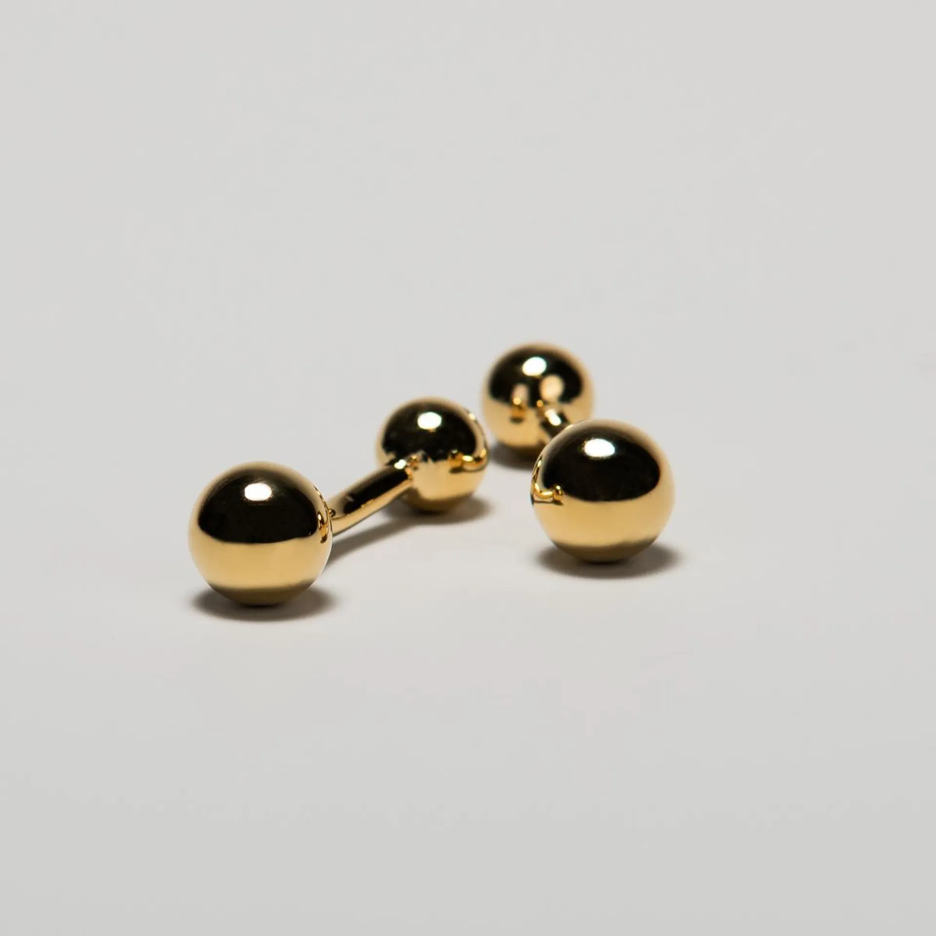 Gold colored cufflinks