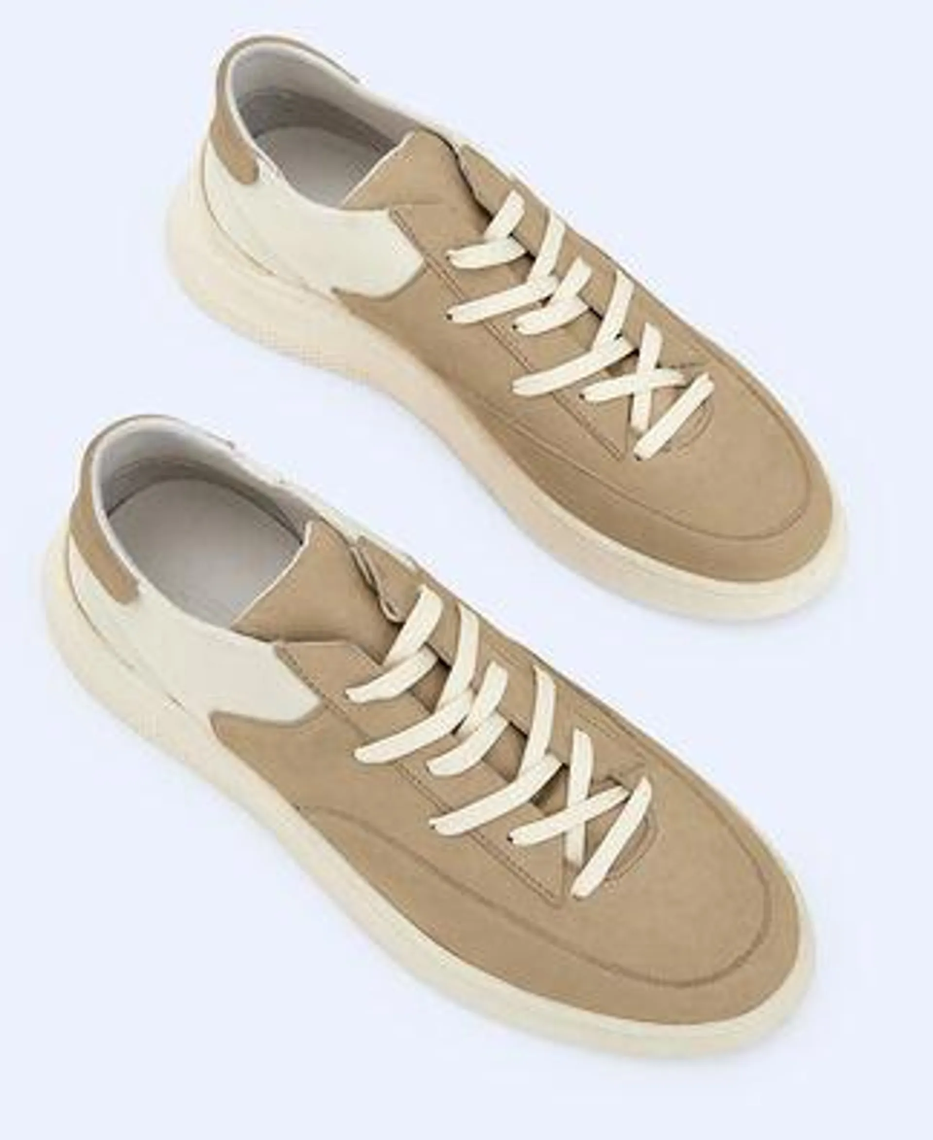 Leather and neoprene sneaker.