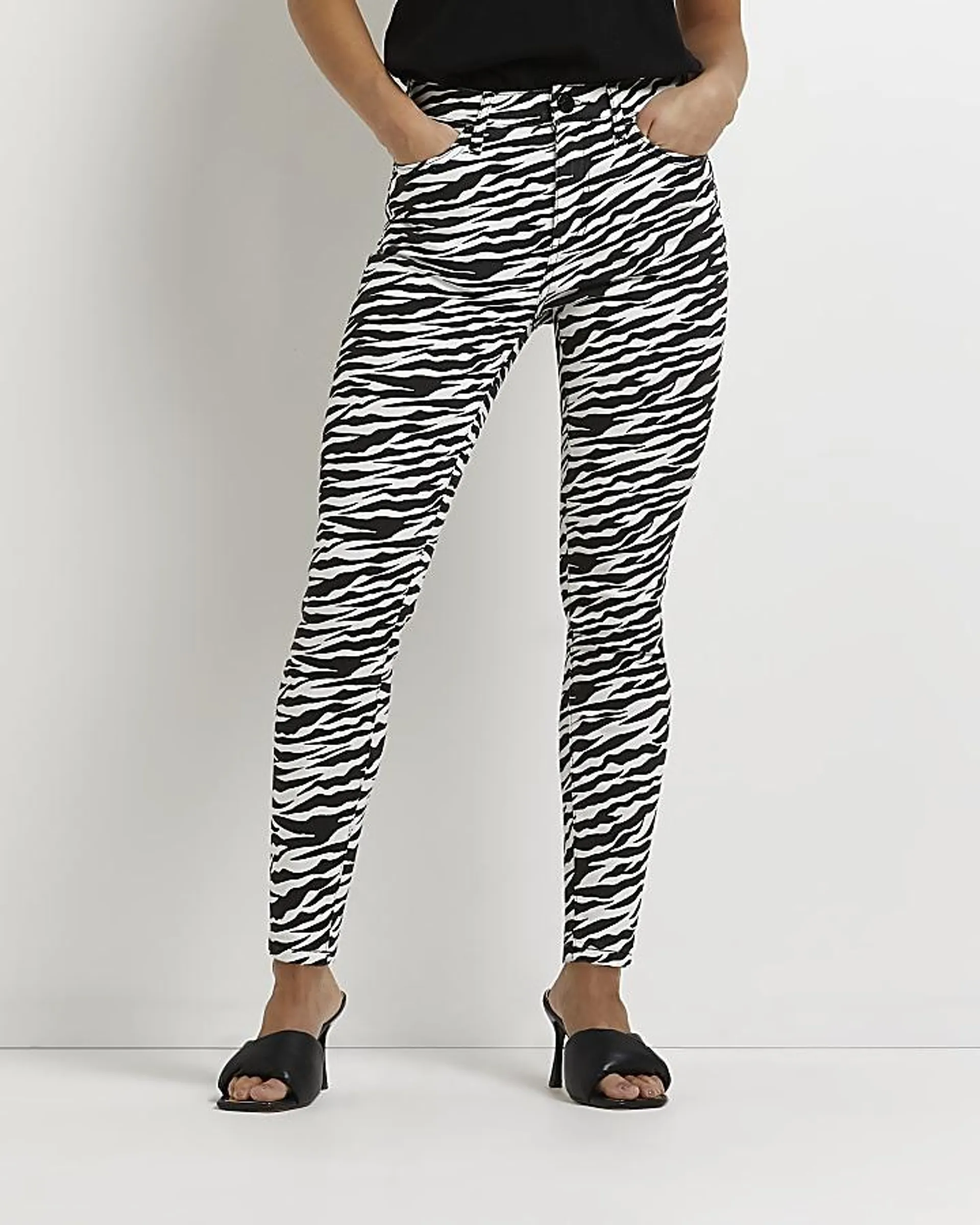 Petite black zebra bum sculpt skinny jeans