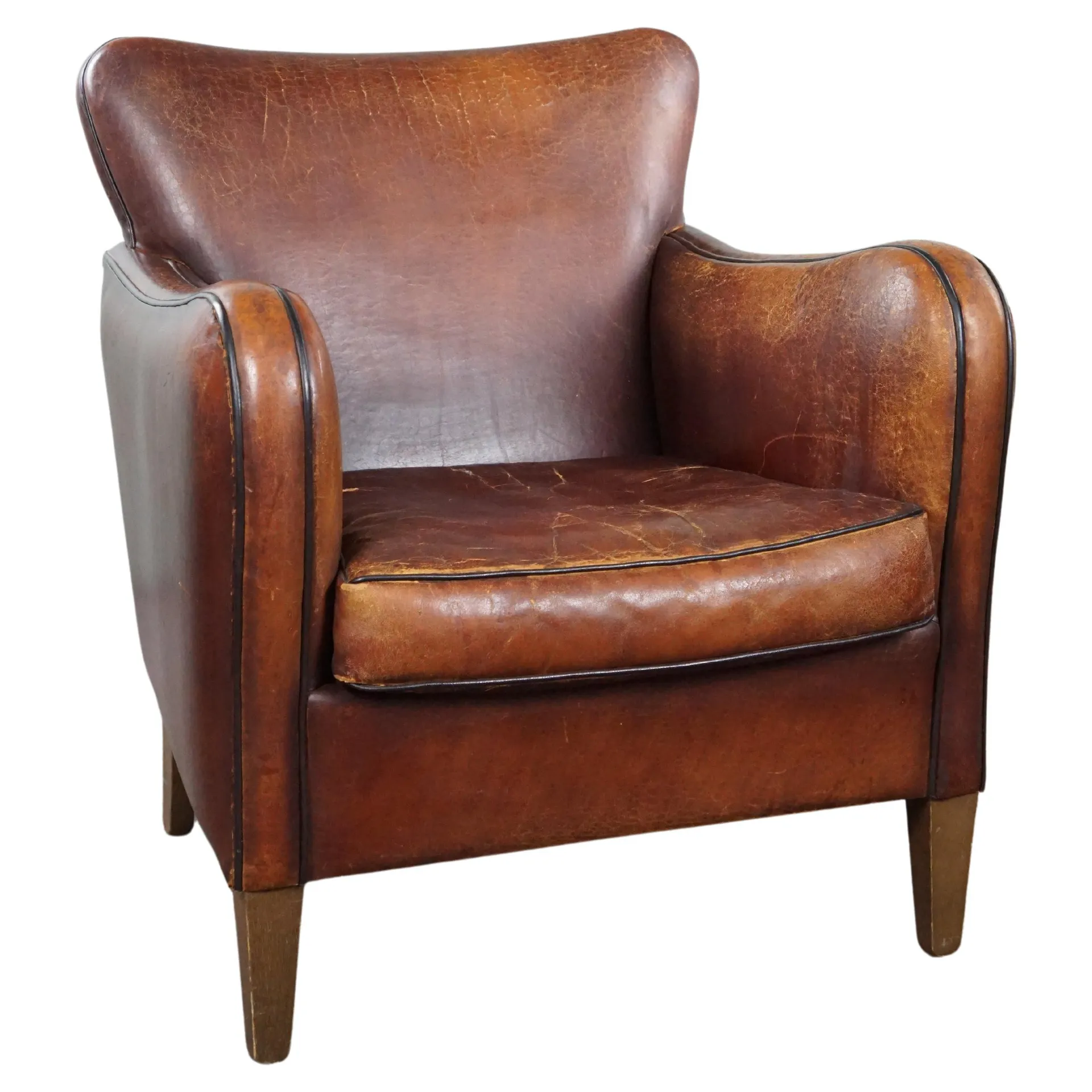 Sturdy, weathered but very comfortable sheepskin armchair