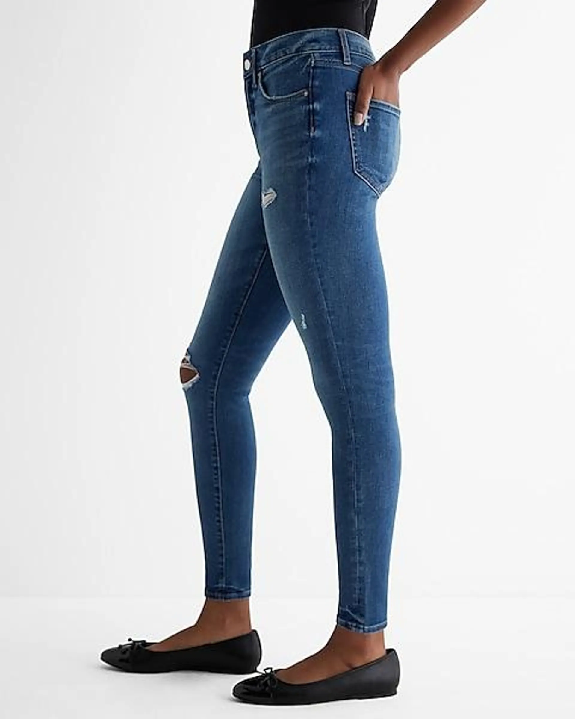 Mid Rise Medium Wash Ripped Skinny Jeans