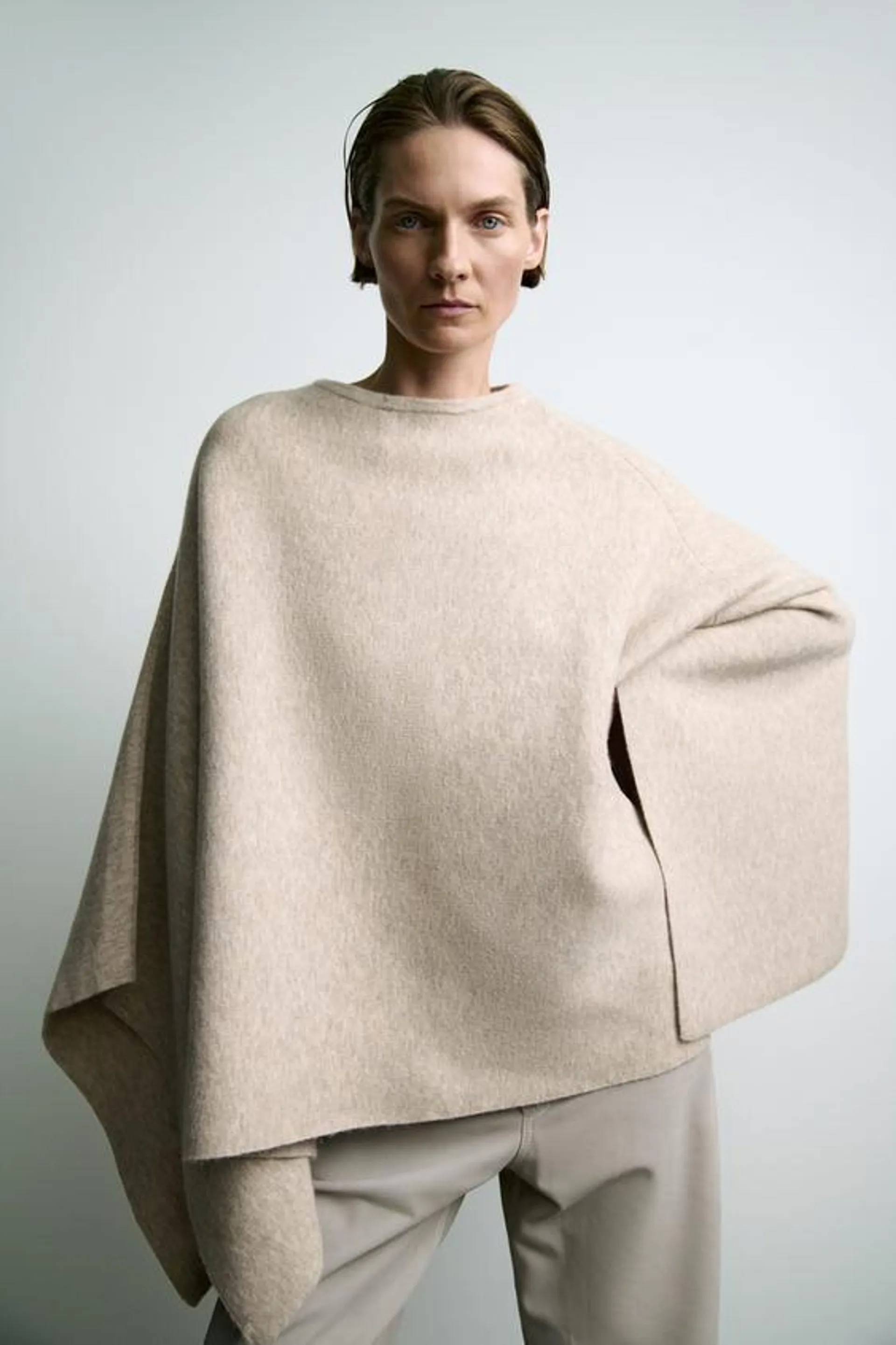 ASYMMETRIC KNIT CAPE