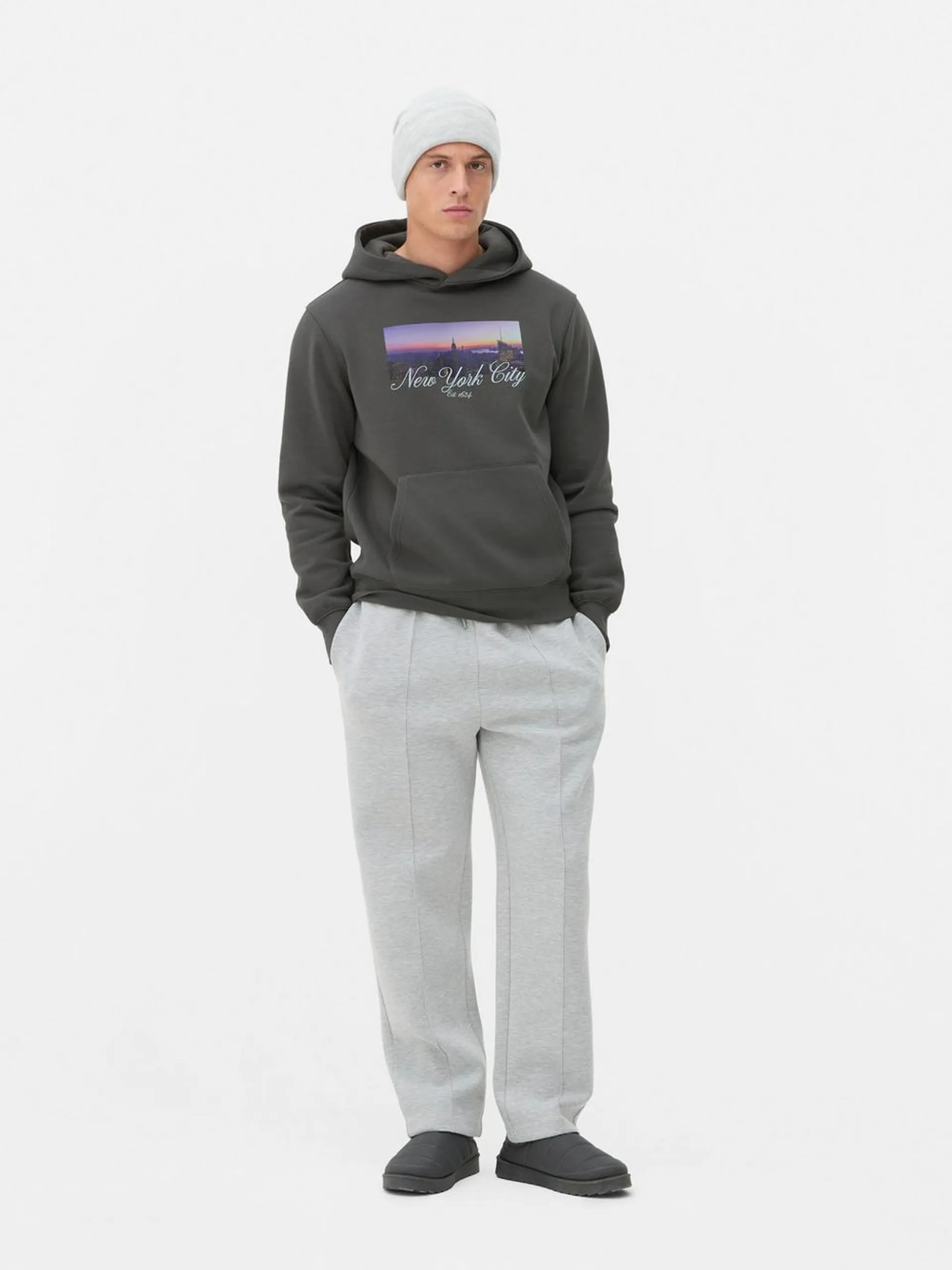 A casual kangaroo pocket hoodie with a New York City skyline graphic