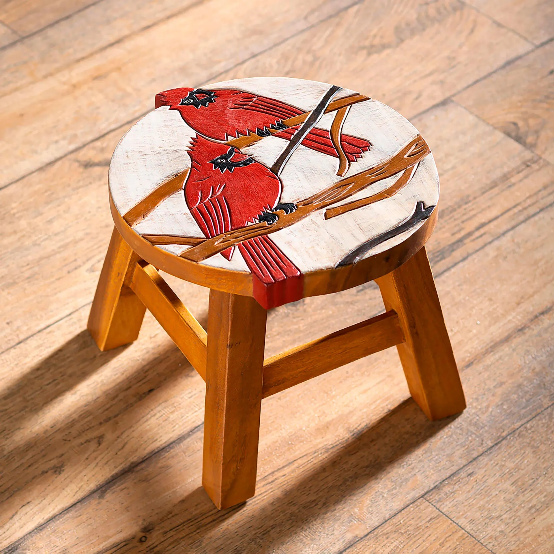 Carved Wooden Footstool with Cardinal Design