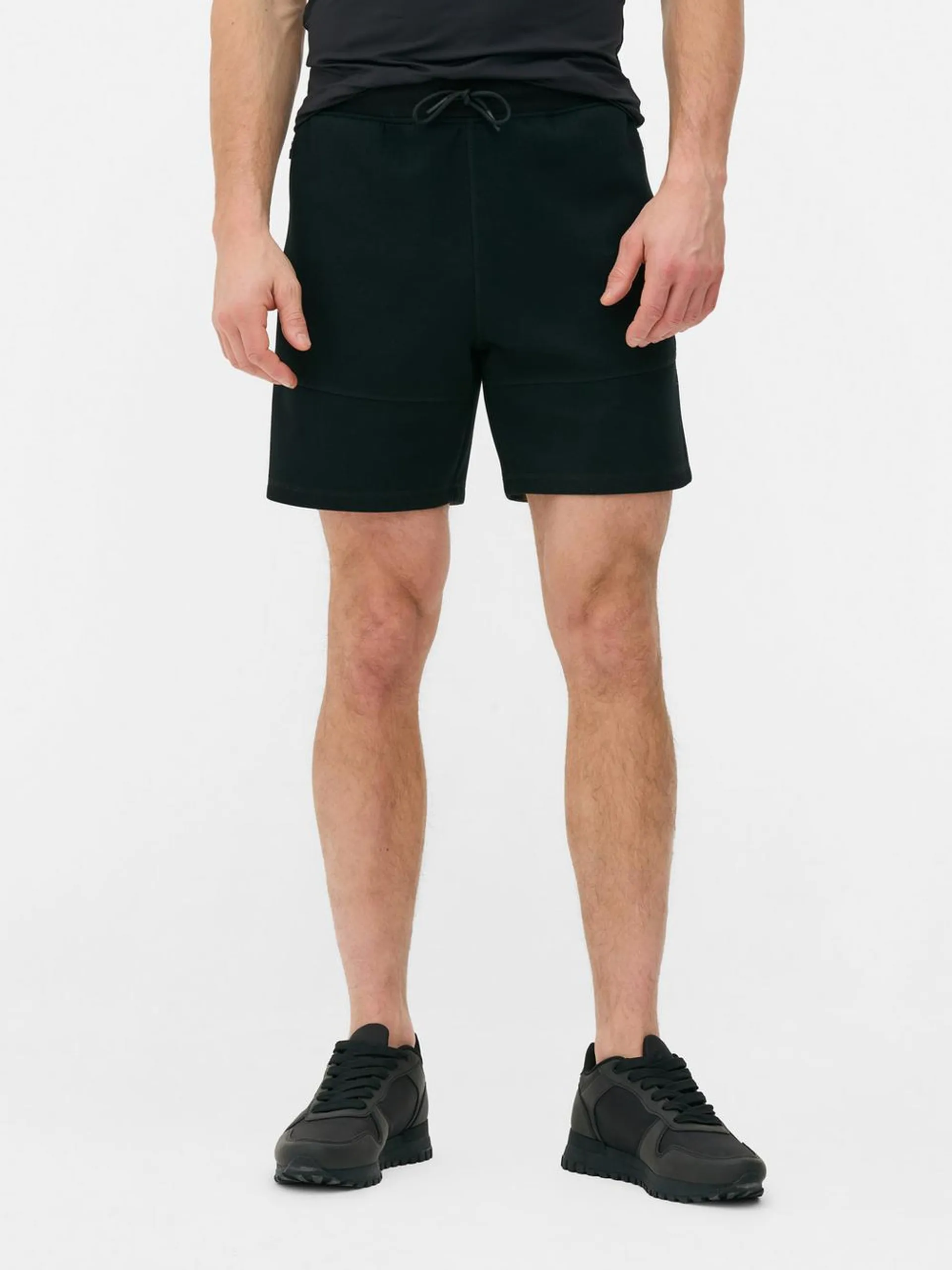 Drawstring sports shorts with side zip pockets