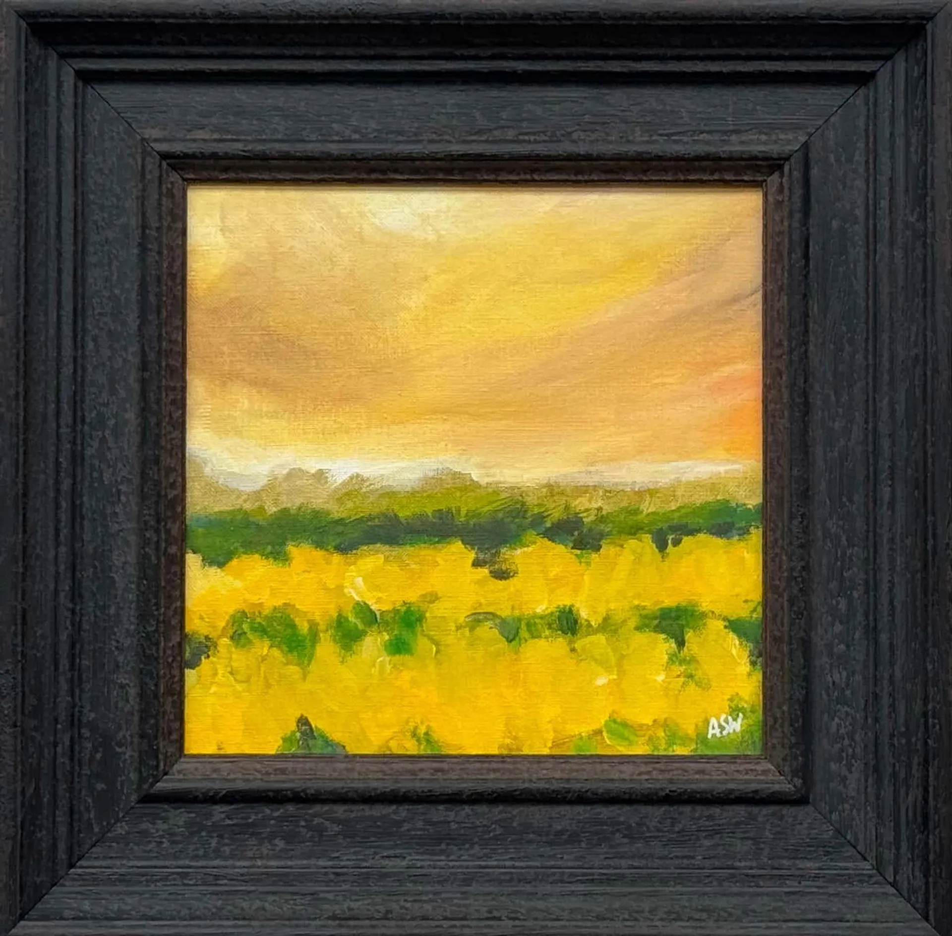 Angela Wakefield Golden yellow field at dusk beneath a glowing amber sky in English Countryside 2025